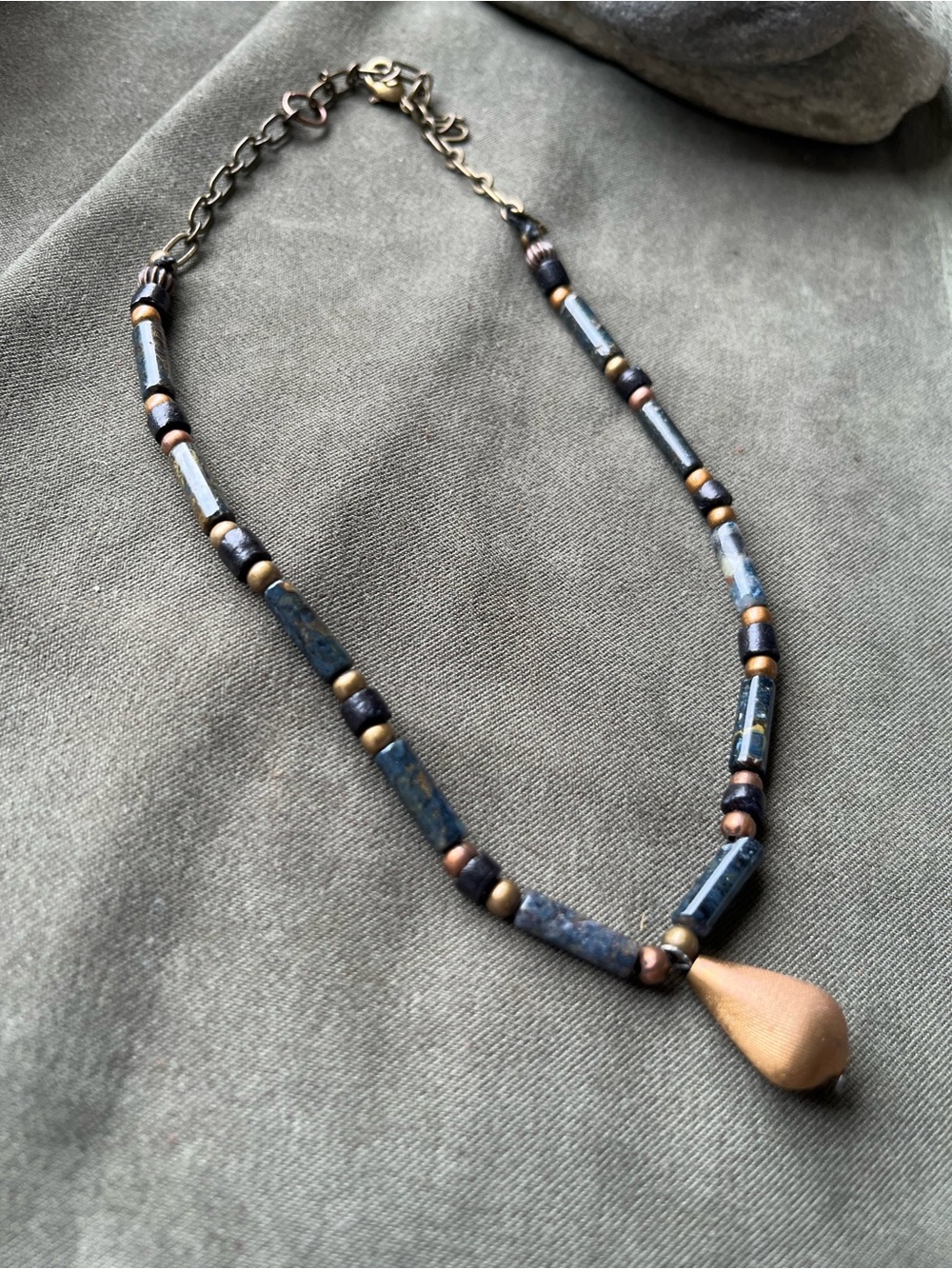 Black gemstones and brass choker style necklace with vintage brass teardrop